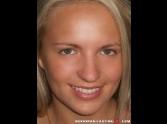 Britney spring is sited on a sofa, legs appart and looking at you